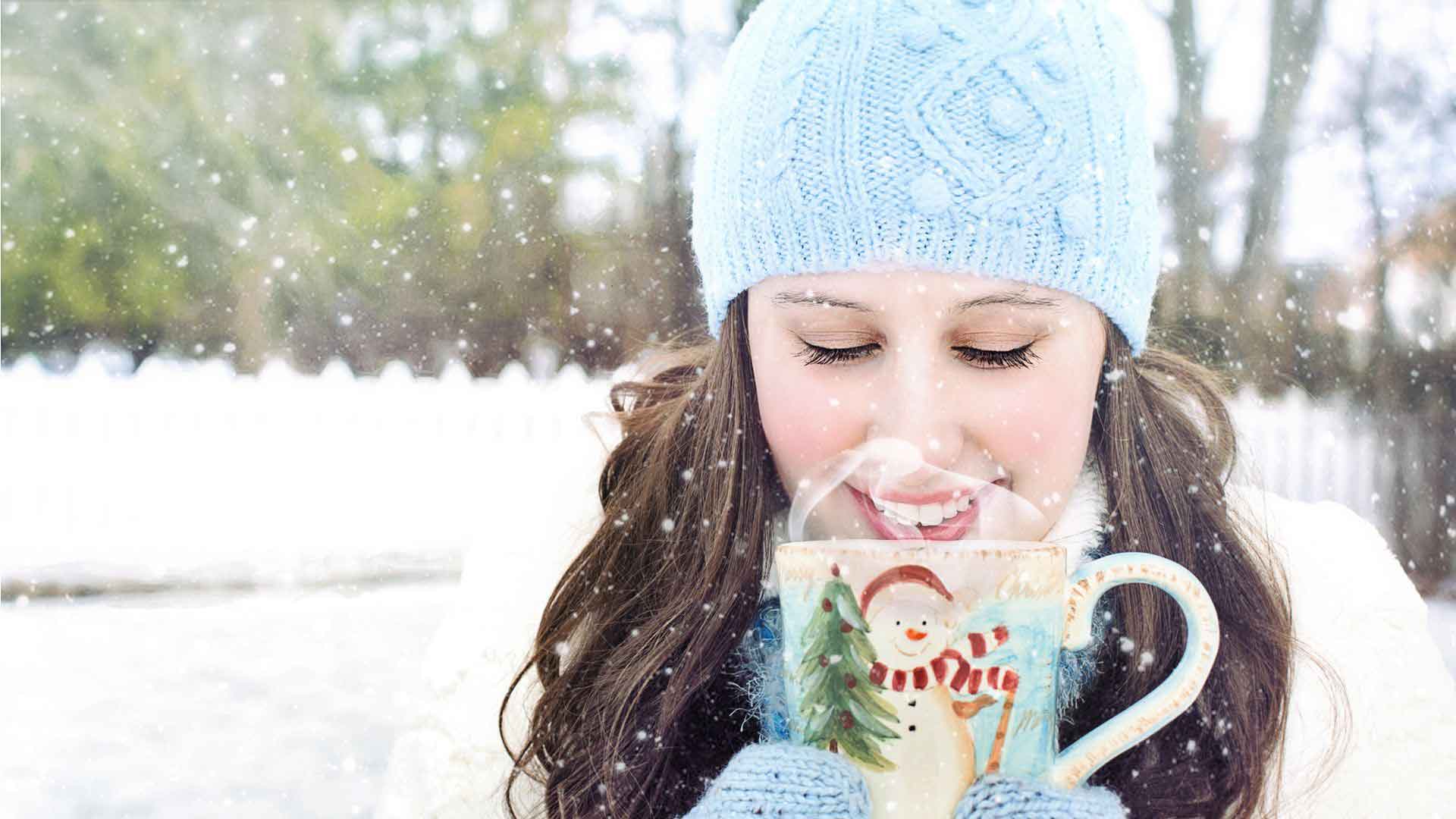 woman drinking in snow on its Christmas Day
